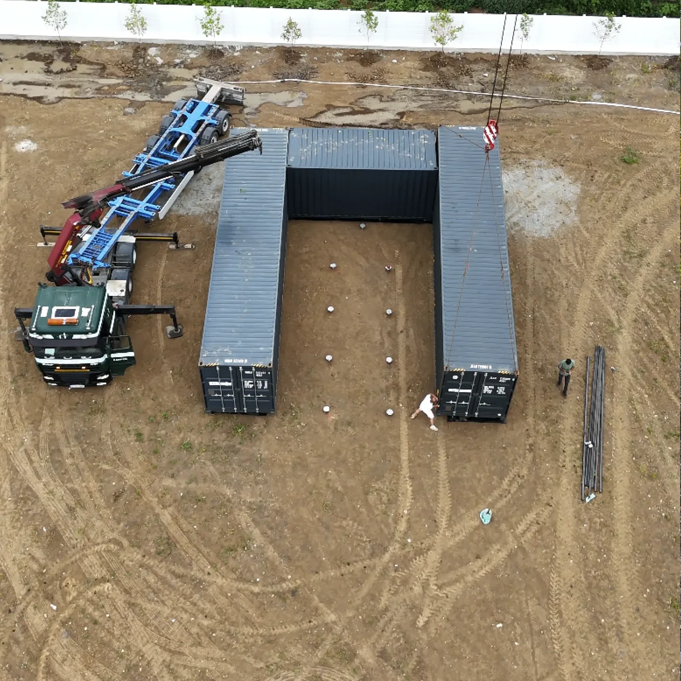 Three shipping containers positioned on MARTETIC screw foundations in Cernica
